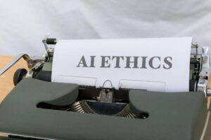 Close-up of vintage typewriter with 'AI ETHICS' typed on paper, emphasizing technology and responsibility.